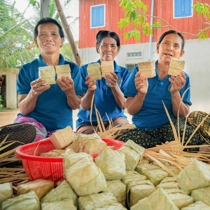 Confirel producers with traditionally wrapped palm sugar, Kampong Speu