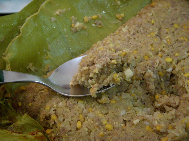 Hand-grinding prepared fish by mortar and pestle, a traditional prahok preparation step
